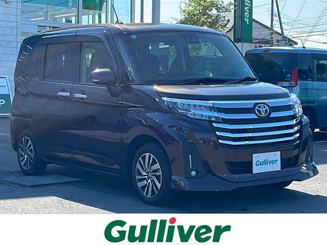 トヨタ ルーミー カスタムG 道東・釧路十勝 2023(令5)年 1万km プラムブラウンパールクリスタルシャイン 4WD/寒冷地仕様/社外メモリナビ AVIC-RW812/　(AM/FM/CD/DVD/BT/HDMI)/フルセグTV/バックカメラ/両側パワースライドドア/レーダークルーズコントロール/プリクラッシュセーフティ/純正前ドライブレコーダー/ETC/前席シートヒーター/アイドリングストップ/横滑り防止装置/LEDヘッドライト/オートライト/電子パーキング/ブレーキホールド/ステアリングスイッチ/革巻きステアリング/サンシェード