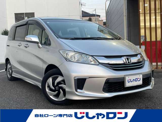 ホンダ フリード ハイブリット ジャストセレクション 千葉県 2015(平27)年 10.2万km スーパープラチナメタリック (株)IDOMが運営する【じしゃロン八千代店】の自社ローン専用車両になります。/こちらは現金またはオートローンご利用時の価格です。自社ローンご希望の方は別途その旨お申付け下さい/両側パワースライドドア/ビルトインETC/Bluetoothオーディオ対応ナビ