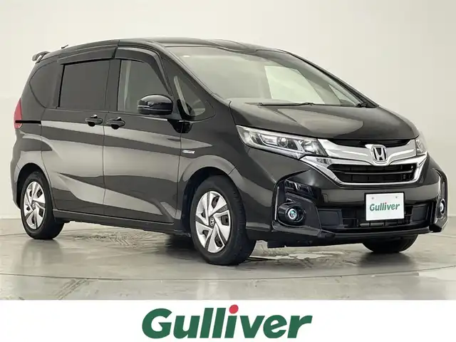 ホンダ フリード ハイブリット G ホンダセンシング 滋賀県 2018(平30)年 8.3万km プレミアムスパークルブラックパール 禁煙車/純正ナビ/（CD/DVD/SD/フルセグTV/BT/FM/AM）/ホンダセンシング/・衝突軽減ブレーキ（CMBS）/・前方衝突警報（FCW）/・誤発進抑制機能（前方・後方）/・急アクセル抑制機能/・車線維持支援システム（LKAS）/・車線逸脱警報（LDW）/・路外逸脱抑制機能（RDM）/・歩行者事故低減ステアリング/・先行車発進お知らせ機能/・標識認識機能（TSR）/・アダプティブクルーズコントロール（ACC：全車速追従型）/・オートハイビーム/バックカメラ/ビルトインETC/両側パワースライドドア/ドライブレコーダー/ステアリングスイッチ/LEDヘッドライト/純正フロアマット