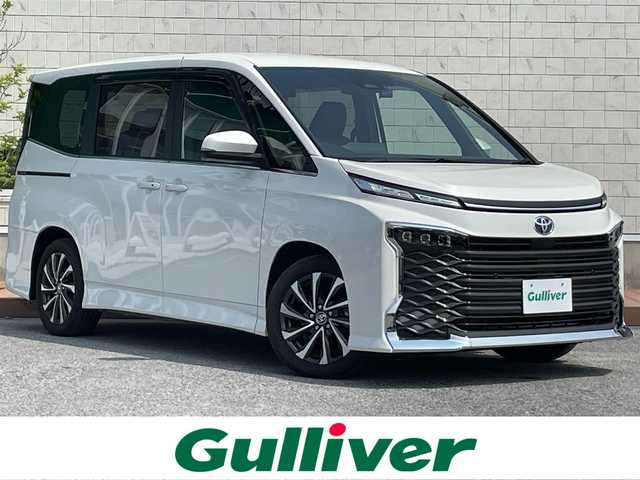 トヨタ ヴォクシー S－Z 滋賀県 2022(令4)年 3.6万km ホワイトパールクリスタルシャイン ガソリン/2WD(FF)/CVT/両側パワースライドドア/純正フリップダウンモニター/純正10.5インチナビ/(AM/FN/CD/DVD/BT/USB/フルセグTV）/バックカメラ/ETC/ドライブレコーダー/ＴｏｙｏｔａＳａｆｅｔｙＳｅｎｓｅ/・プリクラッシュセーフティ/・レーダークルーズコントロール/・レーンキープアシスト	/・横滑り防止装置/・コーナーセンサー/・標識検知機能	/・プロアクティブドライビングアシスト（ＰＤＡ）/ハーフレザーシート/シートヒーター/電格格納ミラー/電動サイドブレーキ/ブレーキホールド/革巻きステアリング/ステアリングスイッチ/オートライト/LEDヘッドライト/オートマチックハイビーム/プッシュスタート/純正フロアマット/純正ドアバイザー