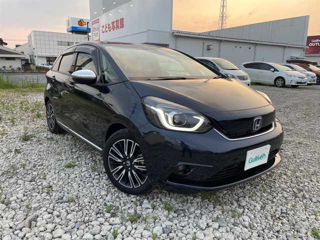 ホンダ フィット e:HEVリュクス 群馬県 2020(令2)年 1.3万km ミッドナイトブルービームM ホンダセンシング/ワンオーナー/ホンダセンシング/・衝突軽減ブレーキCMBS/・誤発進抑制機能/・歩行者事故低減ステアリング/・路外逸脱抑制機能/・アダプティブクルーズコントロール/・LKAS/・先行車発進お知らせ機能/・標識認識機能/ハーフレザーシート/シートヒーター/ハンドルヒーター/純正ナビ（フルセグ/バックカメラ/ Bluetoth/DVD再生）/ETC/前後ドライブレコーダー（SDなし）/プッシュスタート/スマートキー/スタッドレスタイヤ積み込み/取扱説明書/保証書/スペアキー1本
