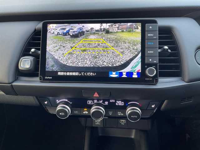 ホンダ フィット e:HEVリュクス 群馬県 2020(令2)年 1.3万km ミッドナイトブルービームM ホンダセンシング/ワンオーナー/ホンダセンシング/・衝突軽減ブレーキCMBS/・誤発進抑制機能/・歩行者事故低減ステアリング/・路外逸脱抑制機能/・アダプティブクルーズコントロール/・LKAS/・先行車発進お知らせ機能/・標識認識機能/ハーフレザーシート/シートヒーター/ハンドルヒーター/純正ナビ（フルセグ/バックカメラ/ Bluetoth/DVD再生）/ETC/前後ドライブレコーダー（SDなし）/プッシュスタート/スマートキー/スタッドレスタイヤ積み込み/取扱説明書/保証書/スペアキー1本