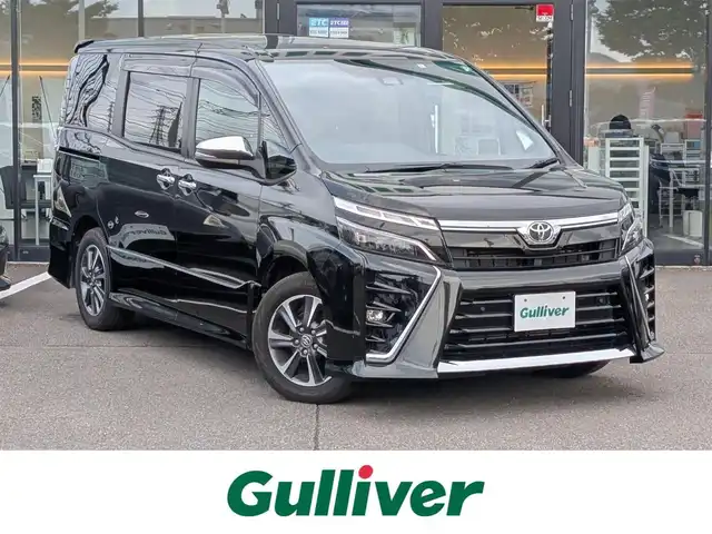 トヨタ ヴォクシー ZS 煌Ⅲ 福井県 2021(令3)年 4.3万km イナズマスパーキングブラックガラスフレーク 純正16インチAW/衝突被害軽減システム/両側パワースライドドア/LEDヘッドライト/前後ドライブレコーダー/クルーズコントロール/前後コーナーセンサー/トヨタセーフティセンス/ハーフレザーシート/バックカメラ/純正SDナビ/ワンセグテレビ/レーンキープアシスト/横滑り防止装置/盗難防止装置/オートマチックハイビーム/アイドリングストップ/純正フロアマット/スマートキー