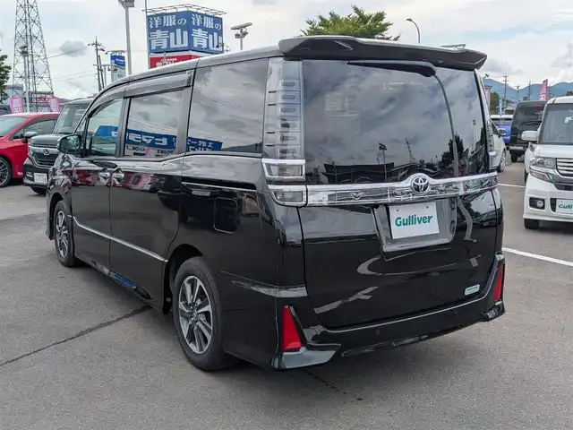 トヨタ ヴォクシー ZS 煌Ⅲ 福井県 2021(令3)年 4.3万km イナズマスパーキングブラックガラスフレーク 純正16インチAW/衝突被害軽減システム/両側パワースライドドア/LEDヘッドライト/前後ドライブレコーダー/クルーズコントロール/前後コーナーセンサー/トヨタセーフティセンス/ハーフレザーシート/バックカメラ/純正SDナビ/ワンセグテレビ/レーンキープアシスト/横滑り防止装置/盗難防止装置/オートマチックハイビーム/アイドリングストップ/純正フロアマット/スマートキー
