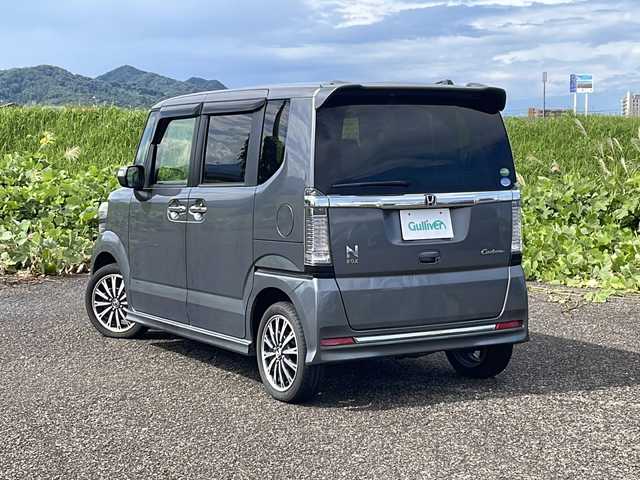 ホンダ Ｎ ＢＯＸ カスタム G ターボ Lパッケージ 新潟県 2015(平27)年 6.4万km ポリッシュドメタルメタリック 4WD/社外SDナビ(CN-RE06D)/CD/DVD/BT/フルセグテレビ/SDミュージックサーバー/バックカメラ/ETC/ドライブレコーダー/衝突被害軽減ブレーキ/クルーズコントロール/両側パワースライドドア/半革シート/ベンチシート/シートヒーター /ミラーヒーター/ステアリングスイッチ/パドルシフト/スマートキー/プッシュスタート/キセノンヘッドライト/オートライト/フォグランプ/純正15インチアルミホイール/社外14インチAW冬タイヤ車載