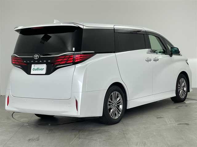 トヨタ アルファード Z 愛知県 2024(令6)年 2万km プラチナホワイトパールマイカ 左右独立ムーンルーフ/12.3インチ純正フリップダウンモニター/メーカー14インチディスプレイオーディオ/（BT/AM/FM/フルセグTV）/全方位バックカメラ/3眼LEDヘッドライト/合皮シート/前席パワーシート/前席＋二列目シートベンチレーション/前席＋二列目シートヒーター/ステアリングヒーター/後席用パワーサイドシェード/電動リアゲート/置くだけ充電/トヨタセーフティセンス/・プリクラッシュセーフティ/・レーントレーシングアシスト/・ブラインドスポッとモニター/・レーダークルーズコントロール/・オートマチックハイビーム/・ロードサインアシスト/・発進遅れ告知機能/・フロントクロストラフィックアラート/・ドライバー異常時対応システム/エコモード/nonoeX/エコモード/純正18インチAW/ドアバイザー/両側パワースライドドア/カーテンエアバッグ