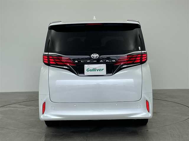 トヨタ アルファード Z 愛知県 2024(令6)年 2万km プラチナホワイトパールマイカ 左右独立ムーンルーフ/12.3インチ純正フリップダウンモニター/メーカー14インチディスプレイオーディオ/（BT/AM/FM/フルセグTV）/全方位バックカメラ/3眼LEDヘッドライト/合皮シート/前席パワーシート/前席＋二列目シートベンチレーション/前席＋二列目シートヒーター/ステアリングヒーター/後席用パワーサイドシェード/電動リアゲート/置くだけ充電/トヨタセーフティセンス/・プリクラッシュセーフティ/・レーントレーシングアシスト/・ブラインドスポッとモニター/・レーダークルーズコントロール/・オートマチックハイビーム/・ロードサインアシスト/・発進遅れ告知機能/・フロントクロストラフィックアラート/・ドライバー異常時対応システム/エコモード/nonoeX/エコモード/純正18インチAW/ドアバイザー/両側パワースライドドア/カーテンエアバッグ