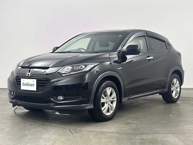 ホンダ ヴェゼル ハイブリッド X 兵庫県 2014(平26)年 5.9万km クリスタルブラックパール ・純正ナビ/Bluetooth/CD/DVD/TV/・バックカメラ/・ビルドインETC/・クルーズコントロール/・電動パーキングブレーキ/・ステアリングリモコン/・純正フロアマット/・純正16インチアルミホイール/・LEDオートライト/・横滑り防止装置/・盗難防止装置/・スマートキー/・プッシュスタートボタン/・ドアバイザー/・W＋サイドエアバッグ/・カーテンエアバッグ