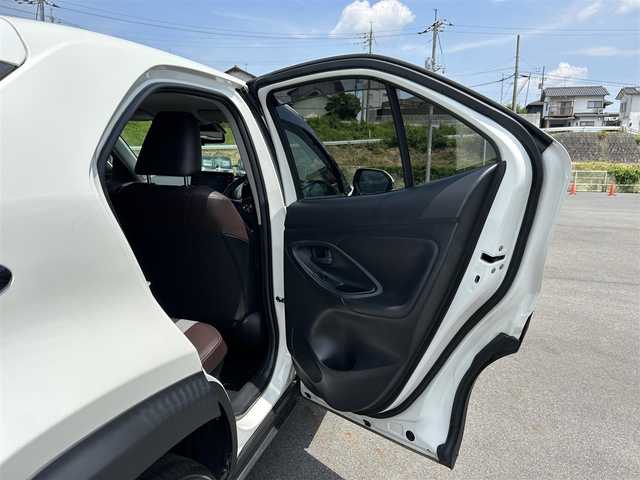 トヨタ ヤリスクロス ハイブリッド Z 岡山県 2021(令3)年 2.5万km ホワイトパールクリスタルシャイン 電動リアゲート/メモリナビ/フルセグテレビ/パノラミックビューモニター/ウィンカーミラー/ETC/クルーズコントロール/ドライブレコーダー/純正アルミホール/Ｂｌｕｅｔｏｏｔｈ接続可能/ＬＥＤヘッドライト/シートヒーター/パーキングアシスト