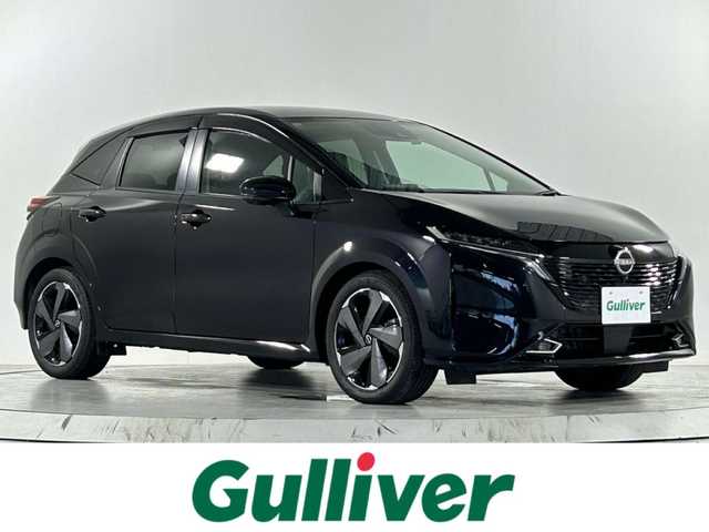 日産 オーラ G レザーエディション 佐賀県 2023(令5)年 0.4万km パープル AA仕入れ：評価点５点、内装評価A点/純正9インチナビ＜フルセグ/Bluetooth＞/アラウンドビューモニター/プロパイロット/置くだけ充電/BOSEプレミアムサウンドスピーカー/インテリジェントルームミラー/電動パーキングブレーキ/オートホールド/レザーシート/純正ドライブレコーダー/純正17インチアルミホイール