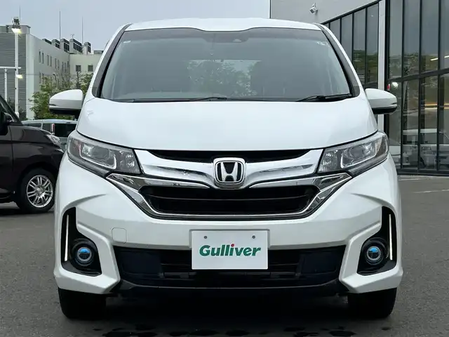 ホンダ フリード ハイブリット G ホンダセンシング 青森県 2017(平29)年 4.2万km ホワイトオーキッドパール ・寒冷地仕様/・4WD/・純正ナビ/・フルセグ/・CD/DVD/SD/USB/Bluetooth/・バックカメラ/・プッシュスタート/・スマートキー/・スペアキー1本/・ホンダセンシング/・横滑り防止/・オートライト/・クルーズコントロール（追従有）/・純正ビルドインETC/・ドライブレコーダー/・両側パワースライドドア/・シートヒーター（N＋D）/・純正フロアマット/・純正AW15インチ/・取扱説明書