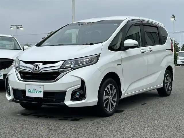 ホンダ フリード ハイブリット G ホンダセンシング 青森県 2017(平29)年 4.2万km ホワイトオーキッドパール ・寒冷地仕様/・4WD/・純正ナビ/・フルセグ/・CD/DVD/SD/USB/Bluetooth/・バックカメラ/・プッシュスタート/・スマートキー/・スペアキー1本/・ホンダセンシング/・横滑り防止/・オートライト/・クルーズコントロール（追従有）/・純正ビルドインETC/・ドライブレコーダー/・両側パワースライドドア/・シートヒーター（N＋D）/・純正フロアマット/・純正AW15インチ/・取扱説明書