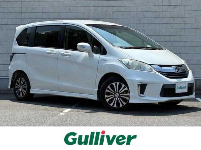 ホンダ フリード ハイブリット ジャストセレクション 大阪府 2014(平26)年 3.9万km ホワイトオーキッドパール 純正8インチナビ/バックカメラ/フルセグ/両側パワースライドドア/クルーズコントロール/横滑り防止装置/前後ドライブレコーダー/ビルトインETC/ハーフレザーシート/HIDヘッドライト/オートライト/純正アルミホイール/ドアバイザー/スマートキー×2