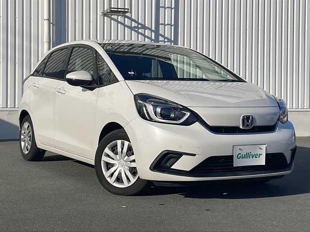 ホンダ フィット e:HEVホーム 三重県 2020(令2)年 4.2万km プラチナホワイトパール 純正９型ナビ/バックカメラ　/追従クルーズコントロール/レーンキープアシスト/ＥＴＣ/ナビ連動ドラレコ/衝突軽減システム/標識認識システム/先行車発進告知/ＳＯＳコール/ＬＥＤオートライト/電子パーキング/盗難防止装置/電動格納ミラー/禁煙車