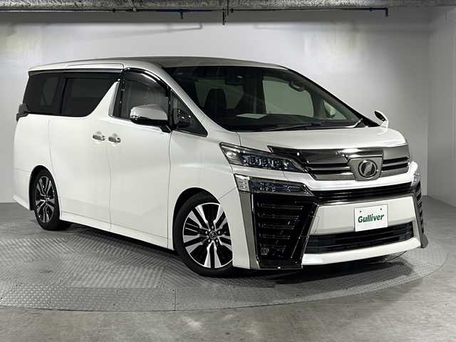 トヨタ ヴェルファイア Z Gエディション 沖縄県 2018(平30)年 4.3万km ホワイトパールクリスタルシャイン ・純正9インチSDナビ/（AM/FM/CD/DVD/BT/SD/フルセグTV）/・レーダークルーズコントロール/・両側パワースライドドア/・パワーバックドア/・純正フリップダウンモニター/・シーケンシャルウインカー/・レザーシート/・キャプテンシート/・（D席）メモリシート/・（前席）パワーシート/・（前席）シートヒーター/・（前席）エアシート/・車高調/・電動オットマン/・バックカメラ/・コーナーセンサー/・三眼LEDヘッドライト/・フロントフォグランプ/・オートマチックハイビーム/・純正18インチAW/・ビルトインETC/・スマートキー/スペアキー有/・プッシュスタート/・ステアリングヒーター/・ステアリングリモコン/・取扱説明書/・保証書