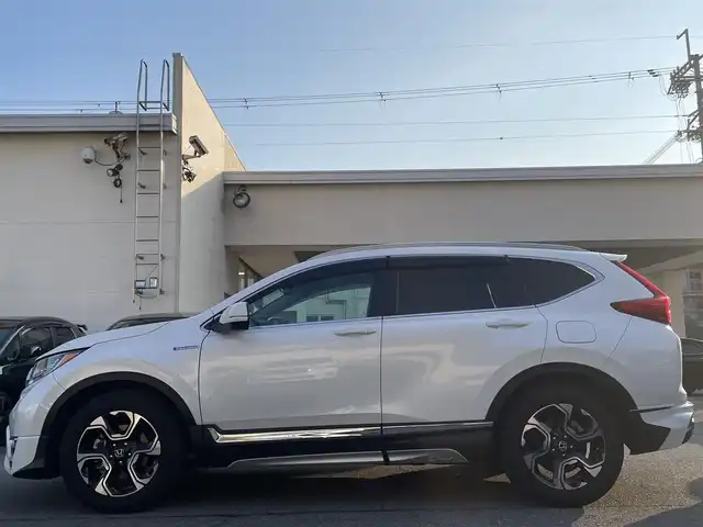 ホンダ ＣＲ－Ｖ ハイブリッド EX・マスターピース 兵庫県 2019(令1)年 5.1万km プラチナホワイトパール 純正インターナビ/フルセグTV/バックカメラ/BlueTooth/サンルーフ/パワーバックドア/レザーシート/パワーシート/シートヒーター/パドルシフト/ルーフレール/ビルドインETC2.0/ホンダセンシング/　・衝突軽減ブレーキ（CMBS）/　・誤発進抑制機能/　・歩行者事故低減ステアリング/　・路外逸脱抑制機能/　・先行車発進お知らせ機能/　・標識認識機能/　・オートハイビーム/　・アダプティブクルコン/　・車線維持支援システム（LKAS）