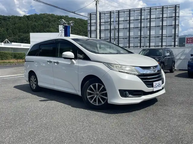 ホンダ オデッセイ G 山形県 2014(平26)年 7.9万km ホワイトオーキッドパール (株)IDOMが運営する【じしゃロン山形店】の自社ローン専用車両になります。/こちらは現金またはオートローンご利用時の価格です。/自社ローンご希望の方は別途その旨お申付け下さい。/純正ナビ/（FM/AM/ラジオ/CD/DVD/TV/Bluetooth）/フリップダウンモニター/両側パワースライドドア/クルーズコントロール/バックカメラ/ビルトインETC/オットマン/ステアリングスイッチ/プッシュスタート/ウィンカーミラー/アイドリングストップ/横滑り防止