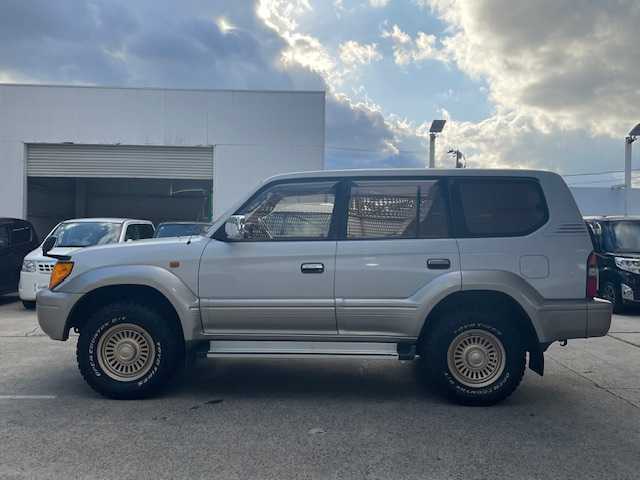 トヨタ ランドクルーザー プラド TX 青森県 2001(平13)年 1.6万km クリスタルシルバーパールM/ライトグレイッシュベージュM 社外１６ＡＷ夏/１６ＡＷ冬/背面タイヤ/ウッドハンドル/取扱説明