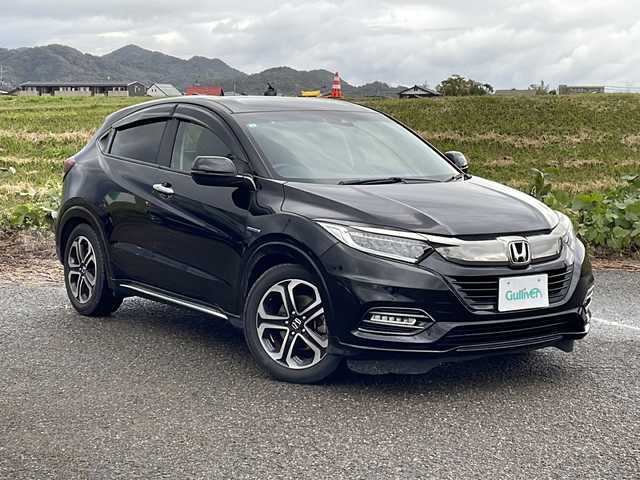 ホンダ ヴェゼル ハイブリッド Z ホンダセンシング 新潟県 2019(平31)年 6.3万km クリスタルブラックパール 4WD/社外SDナビ(AVIC-RZ902)/CD/DVD/BT/フルセグテレビ/ETC/ドライブレコーダー/衝突被害軽減ブレーキ/レーンキープアシスト/レーダークルーズコントロール/半革シート/シートヒーター /ステアリングスイッチ/パドルシフト/スマートキー/プッシュスタート/LEDヘッドライト/オートライト/フォグランプ/純正17インチアルミホイール