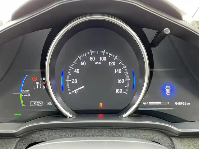 ホンダ フィット ハイブリット L ホンダセンシング 島根県 2018(平30)年 4.9万km プラチナホワイトパール 純正9インチSDナビ(VXM-197VFEi)/(AM/FM/CD/DVD/Bluetooth)/フルセグTV/バックカメラ/衝突被害軽減システム/車線逸脱警報/レーダークルーズコントロール/ハーフレザーシート/ビルトインETC/ドライブレコーダー/LEDヘッドライト/フォグランプ/オートライト/ウィンカーミラー/電動格納ミラー/プッシュスタート/スマートキー/純正フロアマット/ドアバイザー/取扱説明書