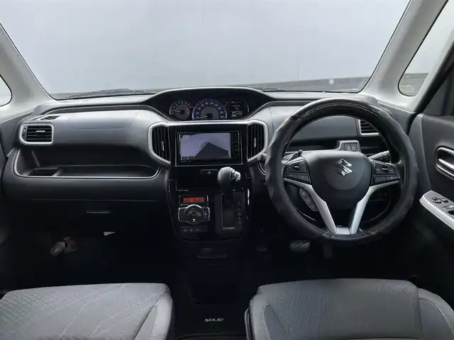 スズキ ソリオ バンディット HV MV 埼玉県 2018(平30)年 10.3万km スーパーブラックパール (株)IDOMが運営する【じしゃロン鳩ヶ谷店】の自社ローン専用車両になりますこちらは現金またはオートローンご利用時の価格です。自社ローンご希望の方は別途その旨お申付け下さい/登録時102740km/両側パワースライドドア/ストラーダSDナビ（CN-RZ746W）/　AM/FM/CD/DVD/MSV/BT/フルセグTV/全方位モニター/ETC/衝突被害軽減システム/レーンキープアシスト/オートクルーズコントロール/横滑り防止機能/プッシュスタート/スマートキー/パドルシフト/D席シートヒーター/LEDヘッドライト/純正15インチAW/電動格納機能付きウインカーミラー/ドアバイザー/純正フロアマット