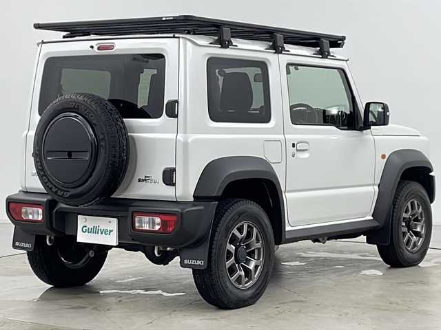 スズキ ジムニー シエラ JC 道央・札幌 2023(令5)年 1.9万km ピュアホワイトP ・4WD/・純正ナビ（TV＆CD＆DVD＆BT＆SD）/・バックカメラ/・スズキセーフティサポート/・アイドリングストップ/・クルーズコントロール/・ステアリングスイッチ/・へッドライトウォッシャー/・ルーフキャリア/・純正ドライブレコーダー（前後）/・ビルトインETC/・スマートキー/・オートライト/・LEDライト