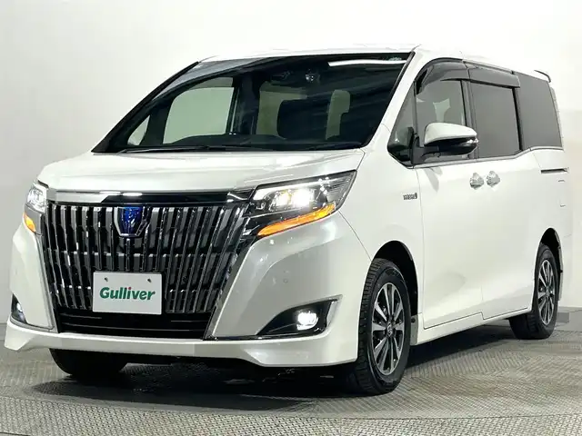 トヨタ エスクァイア ハイブリッド Gi プレミアムパッケージ 大阪府 2019(令1)年 4.2万km ホワイトパールクリスタルシャイン 純正10incナビTV バックカメラ ハーフレザー シートヒーター ステアリングヒーター クルーズコントロール 衝突軽減ブレーキ レーンアシスト オートハイビーム 両側パワースライドドア 前後ドライブレコーダー ETC