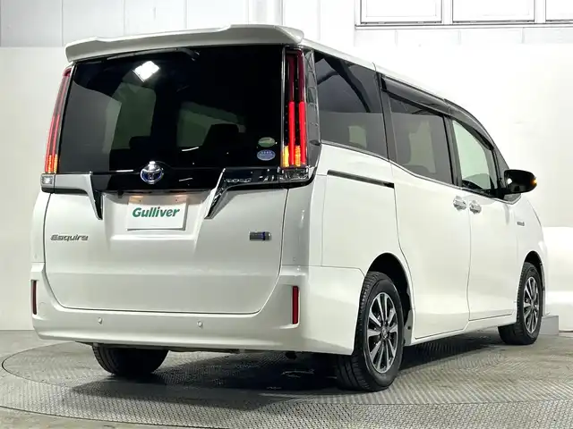 トヨタ エスクァイア ハイブリッド Gi プレミアムパッケージ 大阪府 2019(令1)年 4.2万km ホワイトパールクリスタルシャイン 純正10incナビTV バックカメラ ハーフレザー シートヒーター ステアリングヒーター クルーズコントロール 衝突軽減ブレーキ レーンアシスト オートハイビーム 両側パワースライドドア 前後ドライブレコーダー ETC
