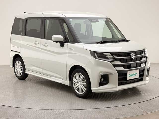 スズキ ソリオ HV MZ 兵庫県 2025(令7)年 0.1万km未満 パール 衝突軽減ブレーキ/レーンキープアシスト/レーダークルーズコントロール/純正ディスプレーオーディオ＆フルセグTV/（CD＆DVD＆BT＆AppleCarplay＆AndroidAuto)/アラウンドビューモニター/両側パワースライドドア/電子パーキング/HUD/シートヒーター/オートライト/LEDライト/サーキュレーター/ヘッドライトレベライザー/スマーキー/プッシュスタート
