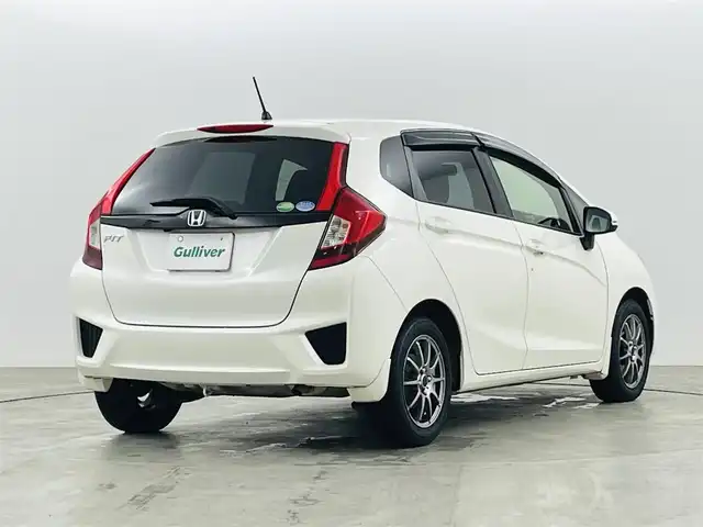 ホンダ フィット 13G Lパッケージ 福島県 2014(平26)年 10.9万km プレミアムホワイトパール 社外ナビゲーション　/【ＣＤ/ＤＶＤ/フルセグＴＶ/FＭ/ＡＭ/Ｂｌｕｅｔｏｏｔｈ】/バックカメラ　/スマートキー　/・プッシュスタート　/オートライト　/純正フロアマット　/横滑り防止装置　/ドアバイザー/取扱説明書　/冬タイヤ積み込み