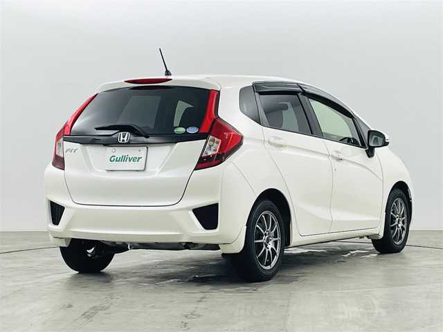 ホンダ フィット 13G Lパッケージ 福島県 2014(平26)年 10.9万km プレミアムホワイトパール 社外ナビゲーション　/【ＣＤ/ＤＶＤ/フルセグＴＶ/FＭ/ＡＭ/Ｂｌｕｅｔｏｏｔｈ】/バックカメラ　/スマートキー　/・プッシュスタート　/オートライト　/純正フロアマット　/横滑り防止装置　/ドアバイザー/取扱説明書　/冬タイヤ積み込み