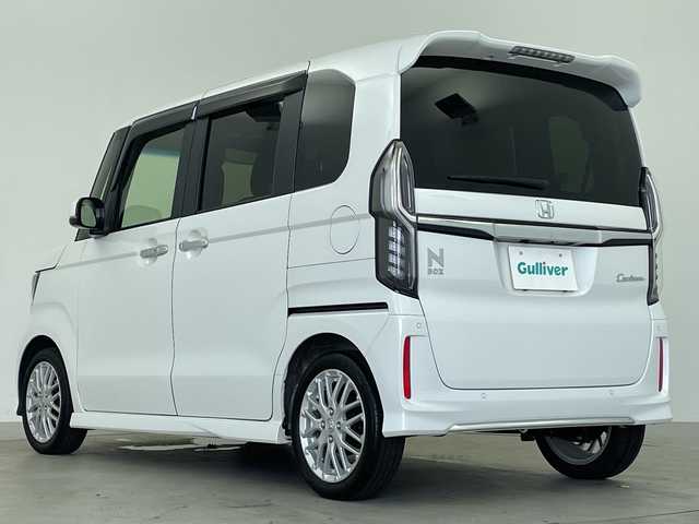 ホンダ Ｎ ＢＯＸ カスタム L ターボ 鹿児島県 2021(令3)年 3.1万km プラチナホワイトパール 純正8インチナビ/（AM/FM/CD/DVD/Bluetooth）/ホンダセンシング/・衝突軽減ブレーキ/・誤発進抑制機能/・後方誤発進抑制機能/・路外逸脱抑制機能/・車線維持支援システム/・アダプティブクルーズコントロール/・オートハイビーム/・先行車発進お知らせ機能/・歩行者事故低減ステアリング/・標識認識機能/バックカメラ/ETC/前後ドライブレコーダー/両側パワースライドドア/ターボ/前席シートヒーター/ステアリングスイッチ/パドルシフト/LEDヘッドランプ/フォグランプ/オートライト/スマートキー/電動格納ミラー/純正15インチAW/純正フロアマット/ドアバイザー