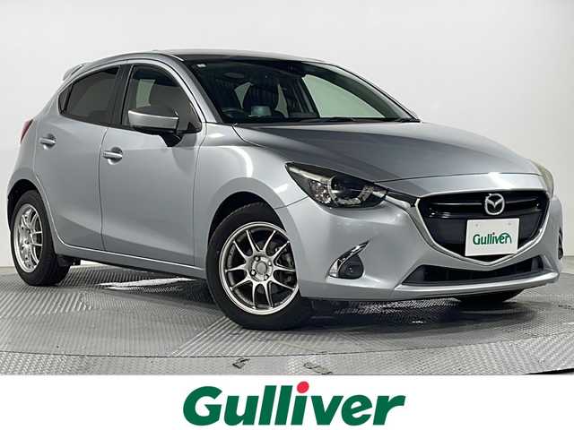 マツダ デミオ XD ツーリング 広島県 2016(平28)年 5.8万km ソニックシルバーM 禁煙車/純正ナビ/バックカメラ/シートヒーター/ヘッドアップディスプレイ/ブラインドスポットモニター/クルーズコントロール/パドルシフト/ＥＴＣ/衝突被害軽減/オートハイビーム/レーンキープ/フォグランプ/ＬＥＤヘッドライト/社外16インチアルミホイール(185/60/R16)/エアバッグ(運転席/助手席/サイド/カーテン)