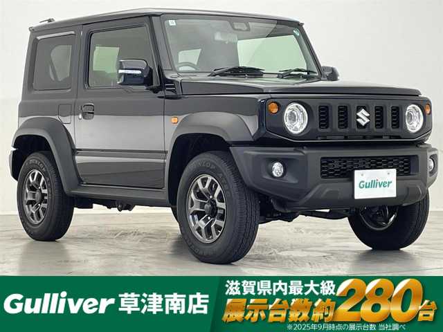 スズキ ジムニー シエラ JC 滋賀県 2024(令6)年 0.6万km ブルーイッシュブラックパール3 社外9インチナビ/【Bluetooth/CD/DVD/フルセグTV】/バックカメラ/4WD/クルーズコントロール/レーンキープアシスト/衝突軽減ブレーキ/ヒルディセントコントロール/リアソナー/LEDヘッドライト/オートマチックハイビーム/ビルトインETC/D/Nシートヒーター/リアタイヤ/社外フロアマット/プッシュスタート/スマートキー/ステアリングリモコン