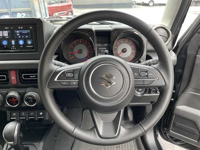 スズキ ジムニー シエラ JC 滋賀県 2024(令6)年 0.6万km ブルーイッシュブラックパール3 社外9インチナビ/【Bluetooth/CD/DVD/フルセグTV】/バックカメラ/4WD/クルーズコントロール/レーンキープアシスト/衝突軽減ブレーキ/ヒルディセントコントロール/リアソナー/LEDヘッドライト/オートマチックハイビーム/ビルトインETC/D/Nシートヒーター/リアタイヤ/社外フロアマット/プッシュスタート/スマートキー/ステアリングリモコン