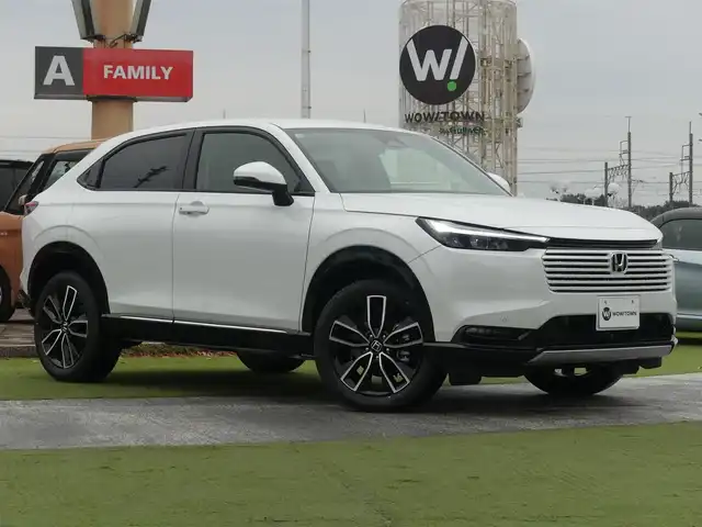 ホンダ ヴェゼル ハイブリッド e:HEV Z 千葉県 2025(令7)年 0.1千km プラチナホワイトパール e:HEV Z　4VC4AG3　Honda CONNECTディスプレー+ETC2.0車載器+ワイヤレス充電器(231000)/ホンダセンシング/・アダプティブクルーズコントロール（ACC）/・車線維持支援システム（LKAS）/・アダプティブクルーズコントロール（ACC）/・後方誤発進抑制機能/・誤発進抑制機能/パワーバックドア/ハーフレザーシート/前席シートヒーター/ホンダコネクトナビ/地デジTV/【Bluetooth接続】/【Apple CarPlay　Android Auto対応】/バックカメラ/ワイヤレス充電/革巻きステアリング/ステアリングスイッチ/ステアリングヒーター/パドルシフト/ETC（2.0）/LEDヘッドライト/フォグライト/ウインカーミラー/コーナーセンサー/純正18インチアルミホイル/サイド/カーテンエアバッグ/Honda スマートキー