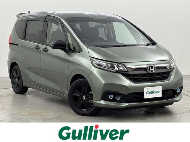 ホンダ フリード G ブラックスタイル 福岡県 2023(令5)年 0.8万km シルバーミストグリーンM ワンオーナー　/後席モニター　/社外ナビ／フルセグＴＶ　/バックカメラ　/ＥＴＣ　/前後ドラレコ　/レーダークルコン　/衝突被害軽減ブレーキ　/レーンキープ　/アイドリングストップ　/両側電動スライドドア　/シートヒーター