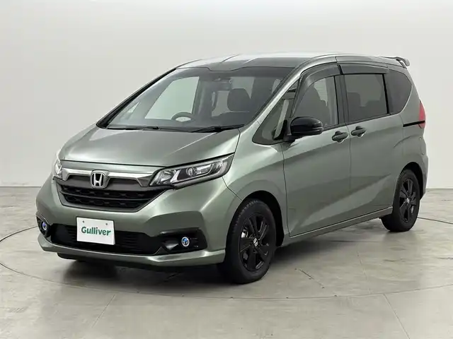 ホンダ フリード G ブラックスタイル 福岡県 2023(令5)年 0.8万km シルバーミストグリーンM ワンオーナー　/後席モニター　/社外ナビ／フルセグＴＶ　/バックカメラ　/ＥＴＣ　/前後ドラレコ　/レーダークルコン　/衝突被害軽減ブレーキ　/レーンキープ　/アイドリングストップ　/両側電動スライドドア　/シートヒーター