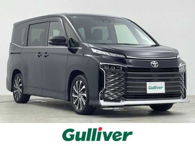 トヨタ ヴォクシー S－Z 千葉県 2022(令4)年 2.8万km アティチュードブラックマイカ 禁煙車/12.1インチフリップダウンモニター　後席モニター/トヨタセーフティセンス/・LDA　レーンディパーチャーアラート　レーンキープ/・PDA　プロアクティブドライビングアシスト/・PCS　プリクラッシュセーフティ　衝突軽減/・PKSB　パーキングサポートブレーキ/・コーナーセンサー/・BSM　ブラインドスポットモニター/両側電動ドア　両側パワースライドドア/快適利便パッケージ/・2列目オットマン/・2列目シートヒーター/・パワーバックドア　電動リアゲート/・ハンドルヒーター　ステアリングヒーター/ユニバーサルステップ/純正10.5インチディスプレイオーディオ/・ディスプレイオーディオplus/・ナビ機能/フルセグTV/CD・DVD/USB入力/HDMI入力/・アラウンドビュー　全方位カメラ/・ビルトインETC2.0/レーダークルーズコントロール/三眼LEDヘッドライト/フォグランプ/オートライト/オートハイビーム/ハーフレザーシート/前席/2列目シートヒーター/純正17インチアルミホイール/革巻きステアリング/ステアリングリモコン/電動パーキングブレーキ