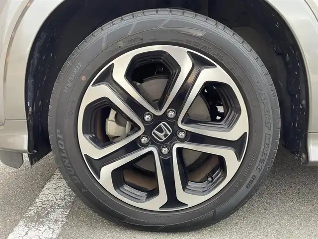 ホンダ ヴェゼル ハイブリッド Z ホンダセンシング 大阪府 2019(令1)年 6.7万km スーパープラチナグレーメタリック 純正ナビ　/  フルセグTV/CD/DVD/Bluetooth/USB/バックモニター/衝突軽減ブレーキ/横滑り防止装置/前席シートヒーター/レーダークルーズコントロール/レーンキープアシスト/ステアリングスイッチ/アイドリングストップ/純正17インチアルミホイール/純正フロアマット/プッシュスタート/スマートキー/ルーフレール/ＥＴＣ/ＬＥＤライト