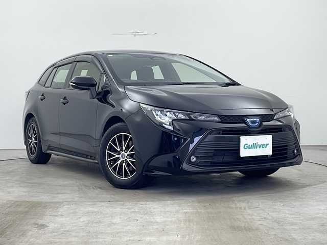 トヨタ カローラツーリング ハイブリッド X 秋田県 2023(令5)年 1.3万km アティチュードブラックマイカ $AA落札車両/4WD/寒冷地仕様/社外ナビ/(フルセグTV/Bluetooth/DVD)/バックカメラ/トヨタセーフティセンス/レーダークルーズコントロール/レーンキープアシスト/衝突被害軽減システム/横滑防止機能/プッシュスタート/スマートキー/スペアキー/エンジンスターター/オートライト/オートマチックハイビーム/LEDヘッドライト/フォグランプ/電動格納ミラー/社外アルミホイール/社外フロアマット/取扱説明書/保証書
