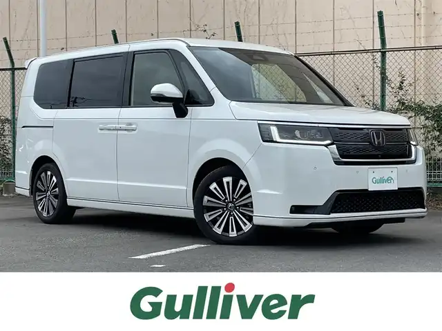 ホンダ ステップワゴン スパーダ eHEV プレミアムライン 東京都 2024(令6)年 2.9万km プラチナホワイトパール １１．４型ホンダコネクトナビ＆フルセグ　/・AppleCarPlay＆AndroidAuto/・BluetoothAudio/・CD/SD/DVD/AM/FM/USB/アラウンドビューモニター/両側パワースライドドア　/パワーバックドア　/ブラインドスポットモニター　/ホンダセンシング/（安全運転支援システム）/・衝突軽減ブレーキ/・後方誤発進抑制機能/・歩行者事故低減ステアリング/・渋滞追従機能付クルーズコントロール/・車線維持支援システム/・先行者発進お知らせ機能/・誤発進抑制/・近距離衝突軽減ブレーキ/・標識認識機能/撥水ファブリックコンビシート /・前席シートヒーター/・キャプテンシート /ＬＥＤヘッドライト /シートバックテーブル/ビルトインETC/プッシュエンジンスタート/スマートキー