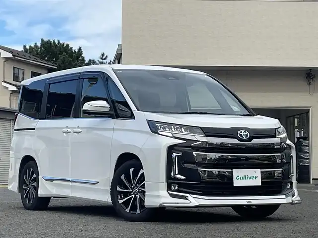 トヨタ ノア ハイブリッド S－Z 宮城県 2022(令4)年 5.4万km ホワイトパールクリスタルシャイン 純正メモリナビ/モデリスタエアロ/デジタルインナーミラー/純正フリップダウンモニター/ユニバーサルステップ/プロジェクションイルミネーション/インテリアイルミネーション/純正フロアマット/ブラインドスポットモニター/ヘッドアップディスプレイ/レーダークルーズコントロール/オートハイビーム/レーンキープアシスト/自動駐車支援システム/アラウンドビューモニター/ブレーキホールド/電動リアゲート/社外ドライブレコーダー前後/ETC2.0/スペアキー×１、エンジンスターター×１/純正AWスタッドレスタイヤ205/55R17