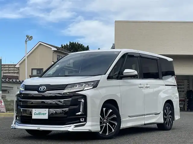 トヨタ ノア ハイブリッド S－Z 宮城県 2022(令4)年 5.4万km ホワイトパールクリスタルシャイン 純正メモリナビ/モデリスタエアロ/デジタルインナーミラー/純正フリップダウンモニター/ユニバーサルステップ/プロジェクションイルミネーション/インテリアイルミネーション/純正フロアマット/ブラインドスポットモニター/ヘッドアップディスプレイ/レーダークルーズコントロール/オートハイビーム/レーンキープアシスト/自動駐車支援システム/アラウンドビューモニター/ブレーキホールド/電動リアゲート/社外ドライブレコーダー前後/ETC2.0/スペアキー×１、エンジンスターター×１/純正AWスタッドレスタイヤ205/55R17
