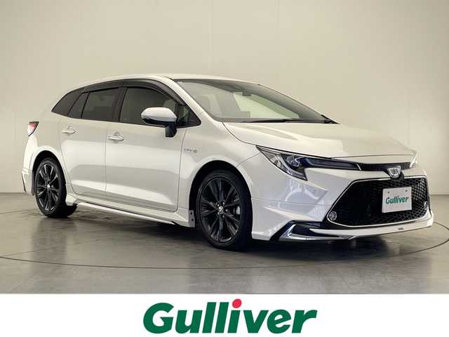 トヨタ カローラツーリング ハイブリッド ダブルバイビー 宮崎県 2019(令1)年 4.2万km ホワイトパールクリスタルシャイン モデリスタフルエアロ/Toyota Safety Sense/〇プリクラシュセーフティ/〇レーントレーシングアシスト/〇ブラインドスポットモニター/〇リアクロストラフィックアラート/〇パーキングサポートブレーキ/〇ロードサインアシスト/〇クリアランスソナー/〇オートマチックハイビーム/〇レーダークルーズコントロール/〇先行車発進告知/純正9インチディスプレイオーディオ/ナビ機能/フルセグTV/バックカメラ/ハーフレザーシート/シートヒーター/ステアリングヒーター/LEDヘッドライト/ビルトインETC/純正17インチAW/前後ドライブレコーダー