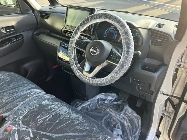 日産 ルークス HWS X プロパイロットED 愛媛県 2024(令6)年 0.2万km フローズンバニラパール 純正SDナビ（Bluetooth/フルセグTV）/アラウンドビューモニター/スマートルームミラー/プロパイロット/アダプティブクルーズコントロール/両側パワースライドドア/前後ドライブレコーダー/純正フロアマット/純正14インチアルミホイール/前後コーナーセンサー/LEDヘッドライト/フォグランプ/スマートキー