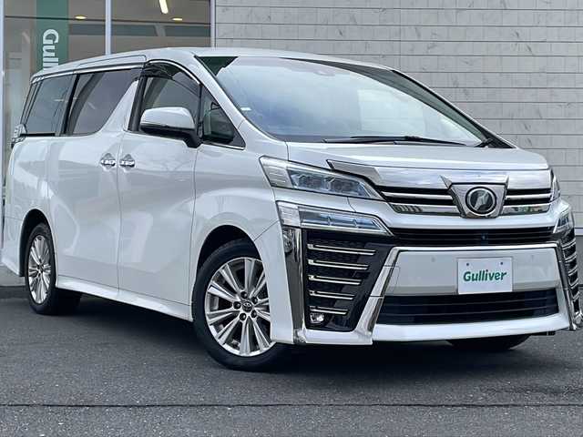 トヨタ ヴェルファイア Z Aエディション 岩手県 2019(平31)年 6.5万km ホワイトパールクリスタルシャイン 純正ナビ(CD/DVD/SD/USB/AUX/ラジオ/BT)/JBLプレミアムサウンド/パノラミックビューモニター/フルセグテレビ/両側パワースライドドア/デジタルインナーミラー/プリクラッシュセーフティ/レーントレーシングアシスト/レーダークルーズコントロール/ブラインドスポットモニター/オートマチックハイビーム/コーナーセンサー/前後ドライブレコーダー/ビルトインETC(2.0)/LEDヘッドライト/フォグランプ/助手席/2列目オットマン/純正18inアルミホイール/スマートキー/ステアリングスイッチ/電動格納ミラー/ウィンカーミラー/ドアバイザー