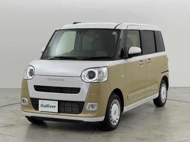 ダイハツ ムーヴ キャンバス ストライプス G 福岡県 2025(令7)年 0.1万km シャイニングホワイトパール/サンドベージュメタリック 純正９型ＤＡ（フルセグＴＶ）　/バックカメラ　/ワイヤレス充電　/ホッとカップホルダー　/コーナーセンサー　/衝突被害軽減ブレーキ　/レーンキープ　/先行車発進お知らせ　/両側電動スライドドア　/シートヒーター　/ＬＥＤヘッドライト