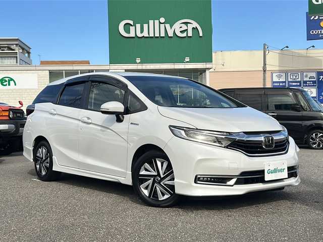 ホンダ シャトル ハイブリッド ホンダセンシング 石川県 2020(令2)年 1.2万km プラチナホワイトパール SDナビ/バックカメラ/ETC/スマートキー/LEDヘッドライト/レーンキープアシスト/横滑り防止装置/衝突被害軽減システム/W＋サイド＋カーテンエアバック/純正フロアマット/純正アルミホイール