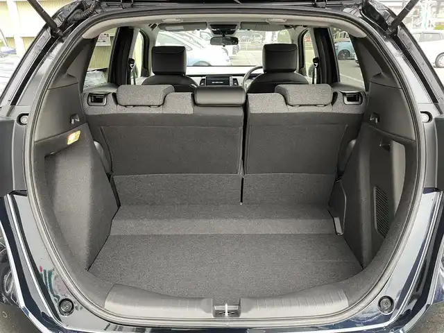 ホンダ フィット e:HEVホーム 東京都 2024(令6)年 0.2万km ミッドナイトブルービームM 純正９型ＳＤナビ＆フルセグ　/ホンダセンシング　/・パーキングセンサーシステム　/・アダプティブクルーズコントロール　/・衝突軽減ブレーキ　/・路外逸脱警報システム　/・歩行者事故低ステアリング/・標識認識機能/・先行車発進お知らせ機能/・路外逸脱警報/・車線維持支援システム/・トラフィックジャムアシスト/・オートハイビーム/ＬＥＤヘッドライト　/ビルトインETC/プッシュエンジンスタート/純正フロアマット/保証書＆取説/Wエアバック＆ABS